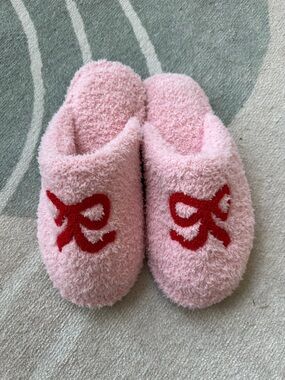 Staykation Plush Pink Slip-On Women's Slippers with Red Bow Accent
